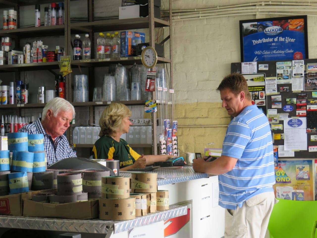 Staff serving customers at the counter