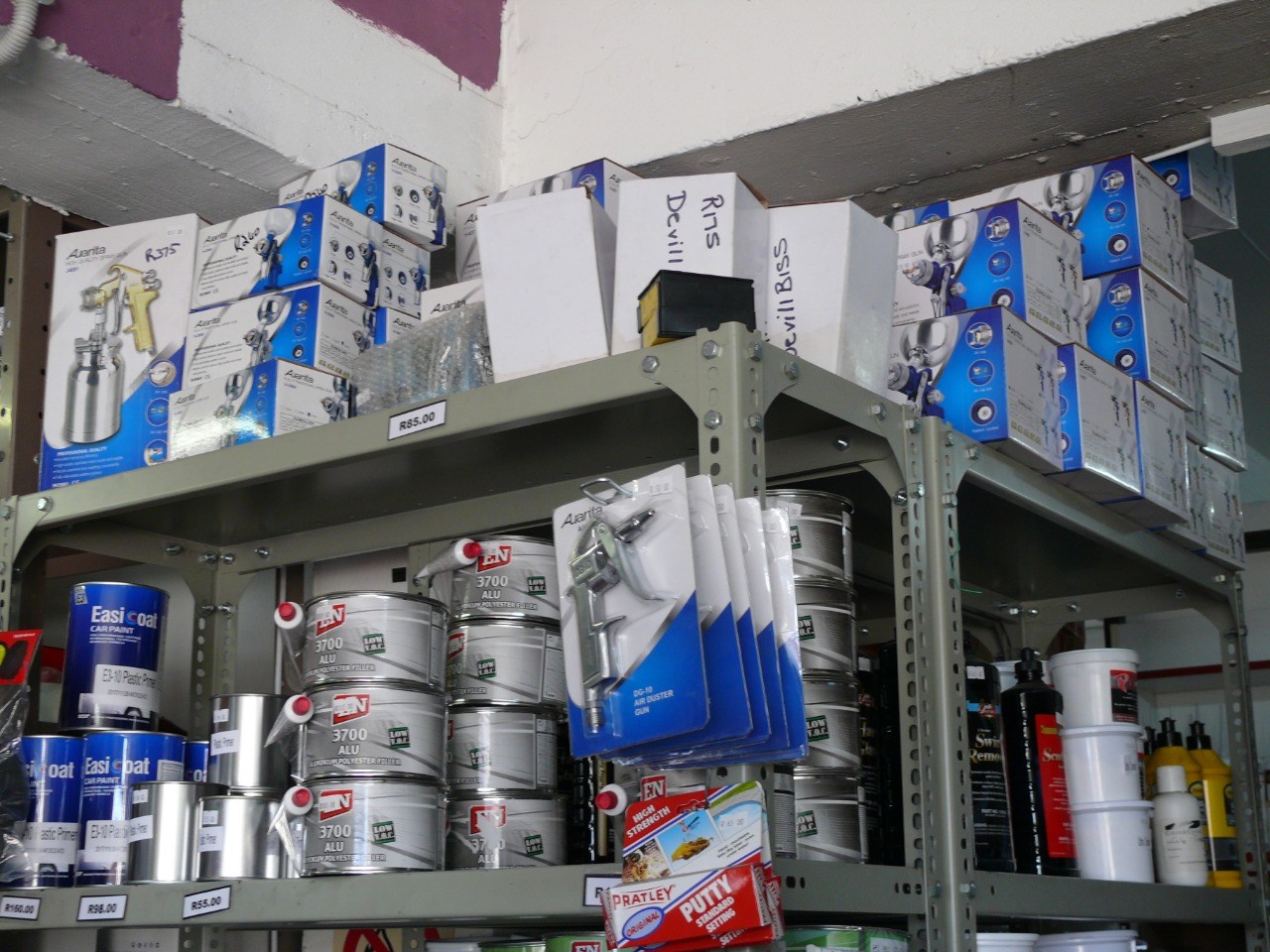 Spray guns and equipment on shelves